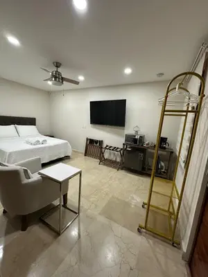a bedroom with a bed and a room with a ladder at House 4-71 in Cartagena de Indias