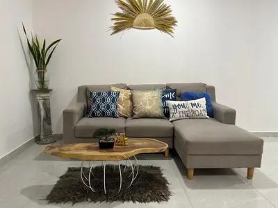 a living room with a couch and a coffee table at Coral del Mar 1 in Tolú