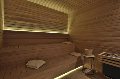 a wooden sauna with a small table in it at Movich Buró 51 in Barranquilla