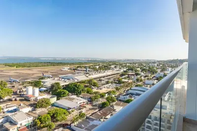 an aerial view of a city from a building at Luxury Apartment Suite Lake View 2 min Airport in Cartagena de Indias