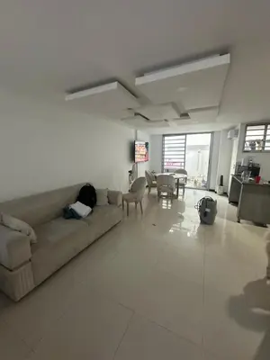 a living room with a couch and a table at Sebastián torres in Barranquilla