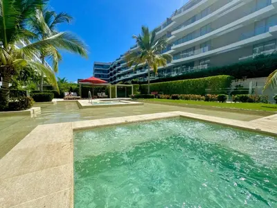 a swimming pool in front of a building at Morros Zoe - Ocean View Paradise, Serena Del Mar, Cartagena in Cartagena de Indias