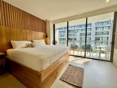 a bedroom with a large bed and a balcony at Morros Zoe - Ocean View Paradise, Serena Del Mar, Cartagena in Cartagena de Indias