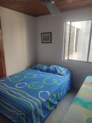a bedroom with a bed and a window at Sun Beach 41 in Cartagena de Indias