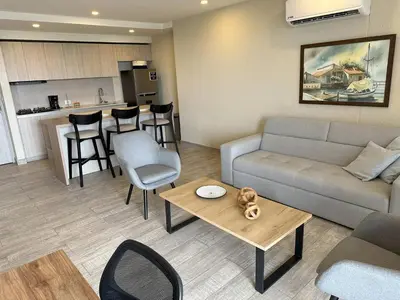 a living room with a couch and a table at Tu refugio en la playa, moderno cómodo con estilo in Cartagena de Indias