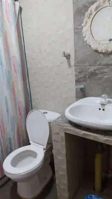 a bathroom with a toilet and a sink at La Dolce Villa! in El Mamey