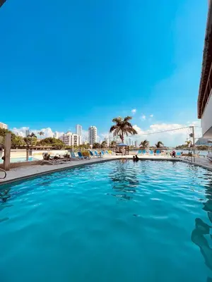 a large swimming pool with a city in the background at Two Bedroom Apt in Cartagena de Indias