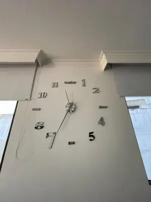 a clock on a wall in a room at Two Bedroom Apt in Cartagena de Indias