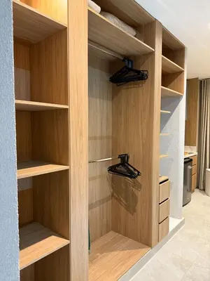 a walk in closet with wooden shelves at NEW Unique 270º view above the city walls in Cartagena de Indias