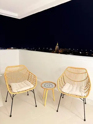 two chairs and a table on a balcony with a view at NEW Unique 270º view above the city walls in Cartagena de Indias