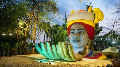 a statue of a man with a bunch of bananas on his head at Comfortable in the heart of the city! in Estación El Salto