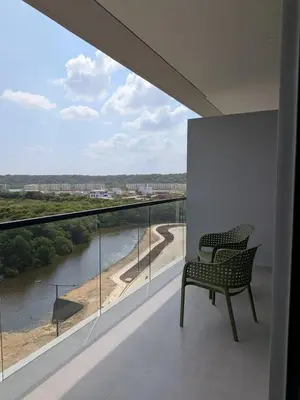 a balcony with two chairs and a view of a river at Manzanillo Morros Kai 526 in Cartagena de Indias