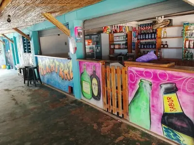 a room with a bar with bottles painted on the wall at Hotel Pesquera rincon berrugas in Berrugas