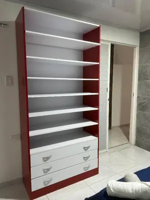 a closet with shelves and a mirror in a room at Rojas House in Barranquilla