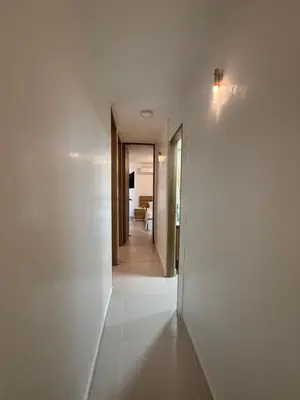 a hallway of a house with white walls and a door at Apartamento con cercania al Mar y centro historico in Cartagena de Indias