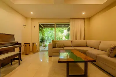 a living room with a couch and a piano at Colonial Elegance in Historic Center /Pool in Cartagena de Indias