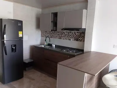 a kitchen with a refrigerator and a counter top at 3 Bedroom Apartment in Cartagena 5 Min to The Beach and The Walled City in Cartagena de Indias