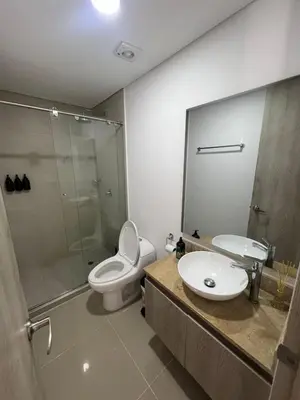 a bathroom with a toilet and a sink and a shower at OceanDrive509 in Cartagena de Indias