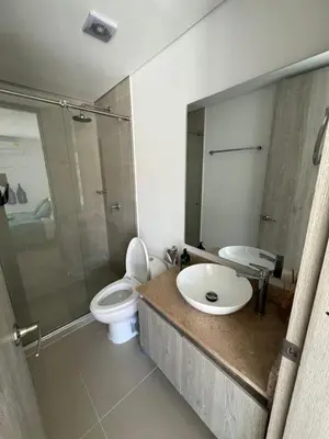 a bathroom with a toilet and a sink and a shower at OceanDrive509 in Cartagena de Indias