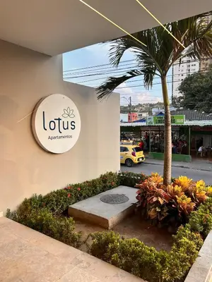 a sign on the side of a building with a palm tree at Beach Lotus 1203 in Cartagena de Indias
