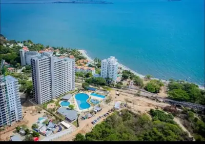 an aerial view of a resort near the ocean at BRISA MARINA, Santa Marina Condominio in Santa Marta