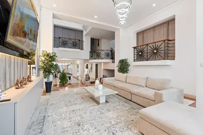 a living room with a couch and a table at 10BR Mansion Beachfront w Pool and Disco in Cartagena de Indias