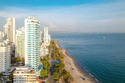 an aerial view of a beach with buildings and the ocean at 10BR Mansion Beachfront w Pool and Disco in Cartagena de Indias