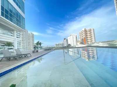 a swimming pool with a view of a city at Apartamento a pasos del mar y centro en Cartagena, piscina sauna & turco in Cartagena de Indias