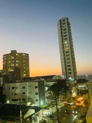 a city with two tall buildings at night at Apartamento a pasos del mar y centro en Cartagena, piscina sauna & turco in Cartagena de Indias