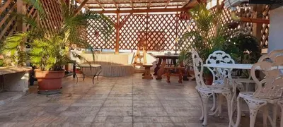 a patio with chairs and tables and potted plants at Habitación Luminosa Manga in Cartagena de Indias