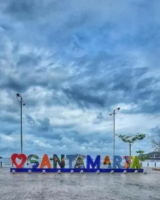 a sign that says happymite under a cloudy sky at Vive el Lujo Caribeño - Mansión Premium con Piscina Privada y Vista al Mar in Santa Marta