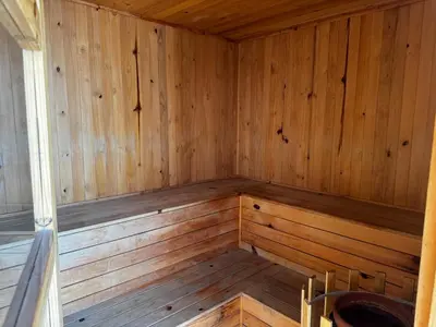 an empty sauna with wooden walls and wooden floors at NEW Premium 1BR Apartment in the Best Area in Barranquilla