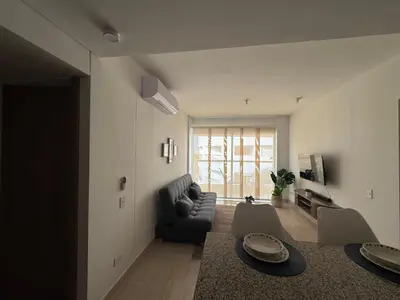 a living room with a couch and a table at Apartamento Serena del mar Trevi in Cartagena de Indias