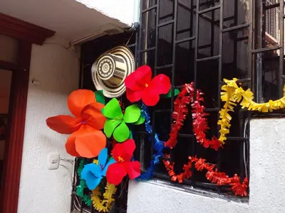 a window with a bunch of flowers on it at Ideal house for Carnival in Barranquilla