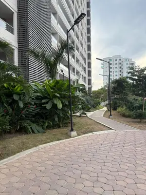 a street light on a sidewalk next to a building at Cardona Suite Santa Marina Santa Marta in Santa Marta