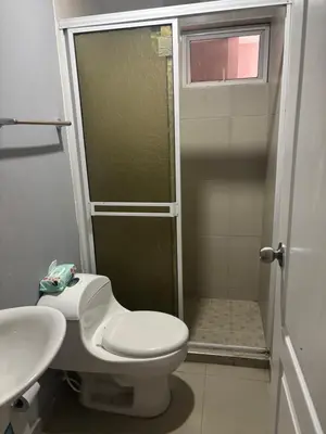 a bathroom with a shower and a toilet and a sink at Gisela Wax More Guess Room in Cartagena de Indias