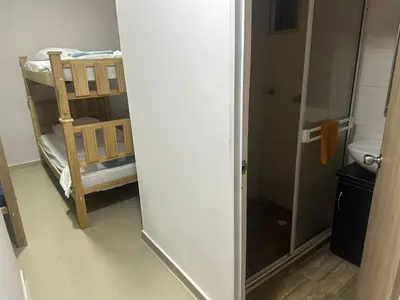 a small bathroom with a bunk bed and a toilet at Apartment in Barranquilla in Barranquilla
