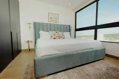 a bedroom with a large bed with a large window at Now booking April! Walking to City Center 2 BDRM in Cartagena de Indias