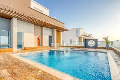 a swimming pool in the backyard of a house at BEACH FRONT Condo walking to centro and beach 2BD in Cartagena de Indias