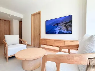 a living room with a couch and a table at 2-Bedroom Apartment with Private Pool - Morros Kai in Cartagena de Indias