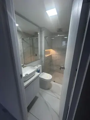 a bathroom with a sink and a toilet and a shower at Apt 2605 in Cartagena de Indias