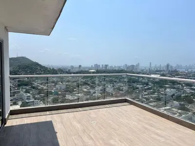 a balcony with a view of a city at Apartamento 3 Habitaciones con Piscina cerca de las Playas de Cartagena in Cartagena de Indias