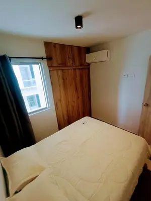 a small bedroom with a bed with a window at Apartamento en Cartagena cerca al Mar in Cartagena de Indias