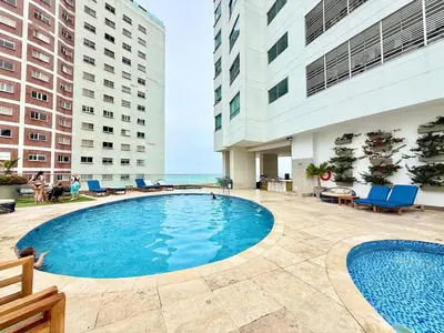 a swimming pool in the middle of a building at 2Br apartment in front of the beach in Cartagena de Indias