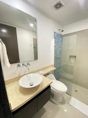 a bathroom with a sink and a toilet and a shower at 2Br apartment in front of the beach in Cartagena de Indias