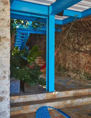 a blue structure with a plant on the stairs at NOK Award Winning 4BR Villa wih pool at Getsemani in Cartagena de Indias