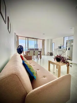 a living room with a couch and a table at Vista soñada cerca al mar y centro histórico in Cartagena de Indias