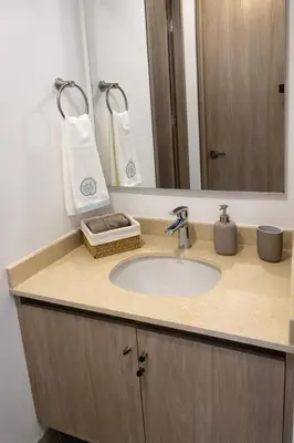 a bathroom counter with a sink and a mirror at Apartamento en Santa Marina in Santa Marta