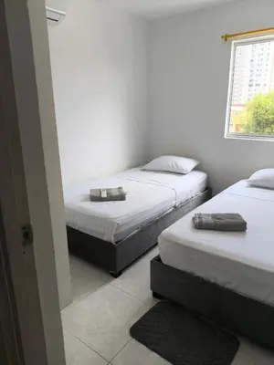two twin beds in a room with a window at cartagena luxury in Cartagena de Indias