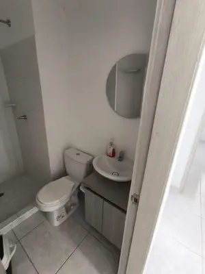 a bathroom with a toilet and a sink and a mirror at cartagena luxury in Cartagena de Indias
